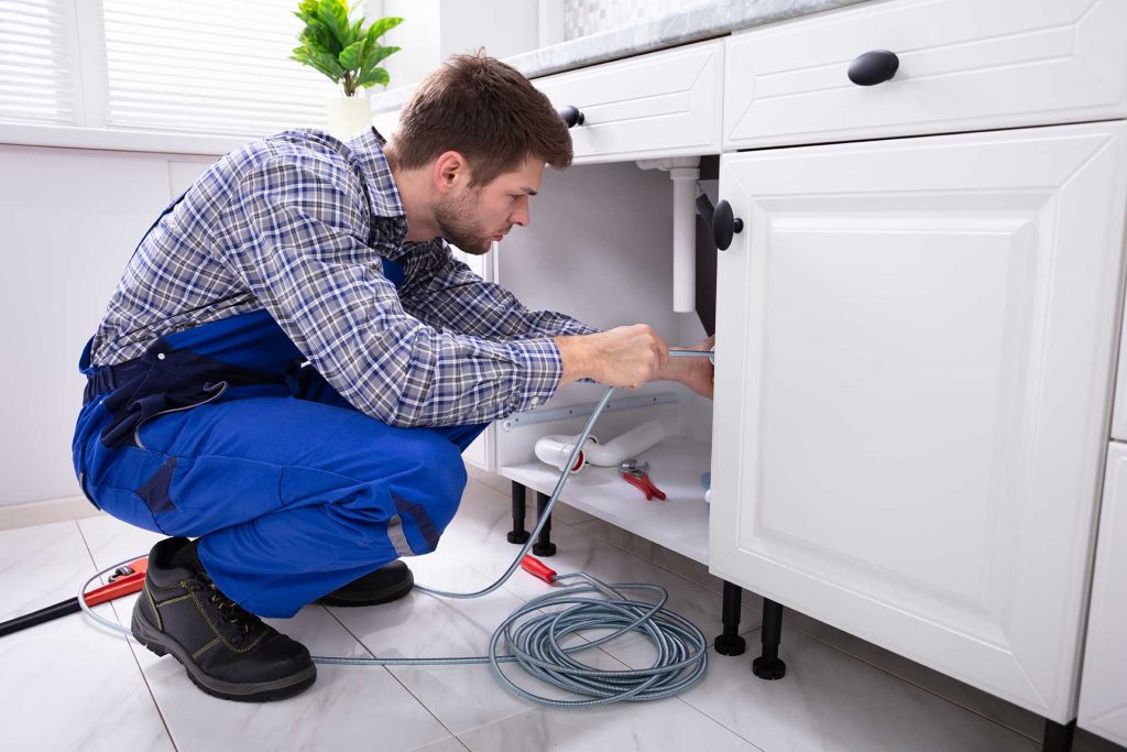 What is the role of a water heater in plumbing systems?